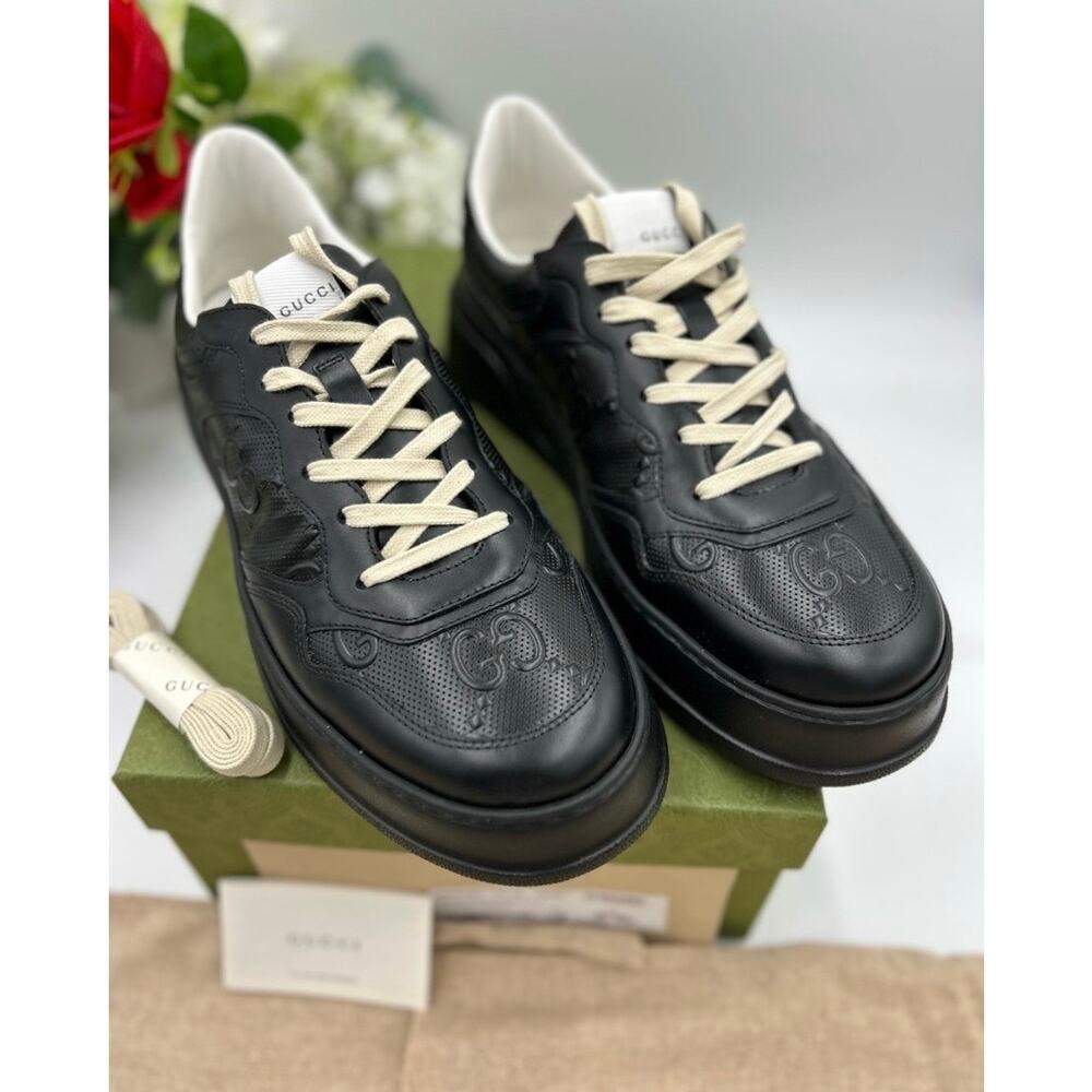 Men's Gucci, GG embossed, black leather sneakers size 11 fits 11.5 made in Italy